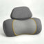 neck massager pillow in charcoal grey fabric with a honeycomb-patterned center panel, yellow trim and removable headrest