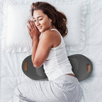 Woman lying on a massage mat on a bed
