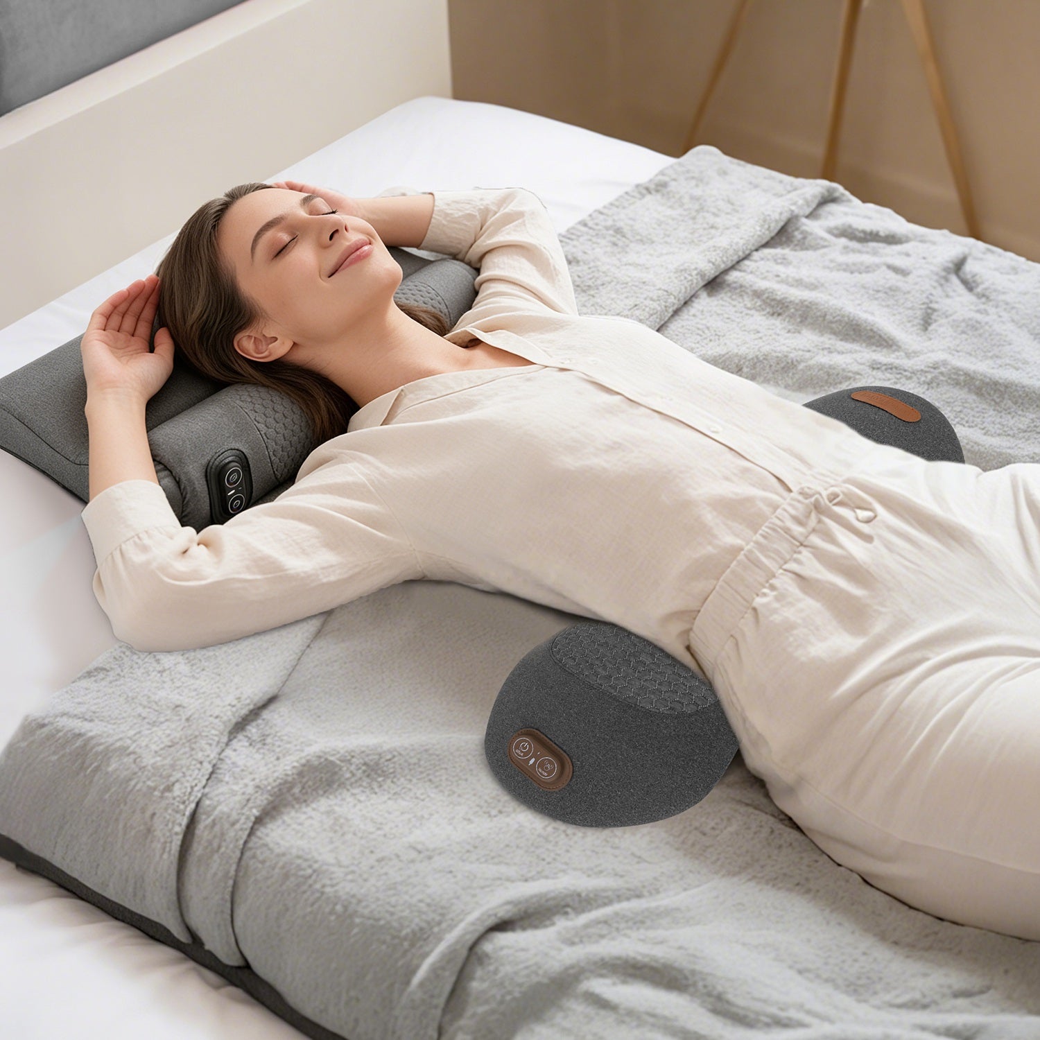 Woman lying on a massage pillow in a bedroom setting
