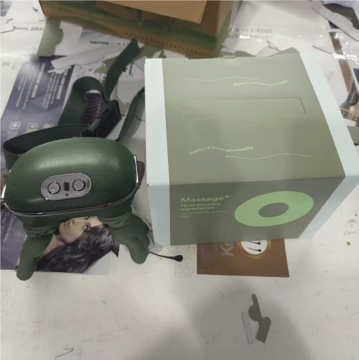 Green neck massager with packaging on a cluttered surface