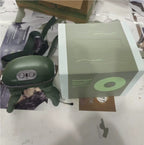 Green neck massager with packaging on a cluttered surface
