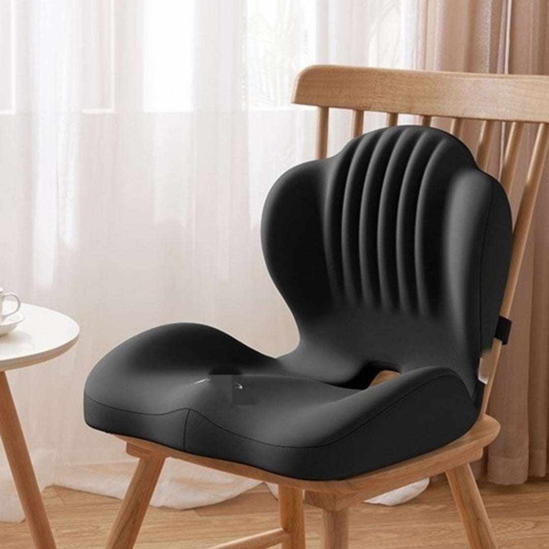 ergonomic seat cushion in black with a smooth contoured seat, raised sides and a ribbed back support Main image