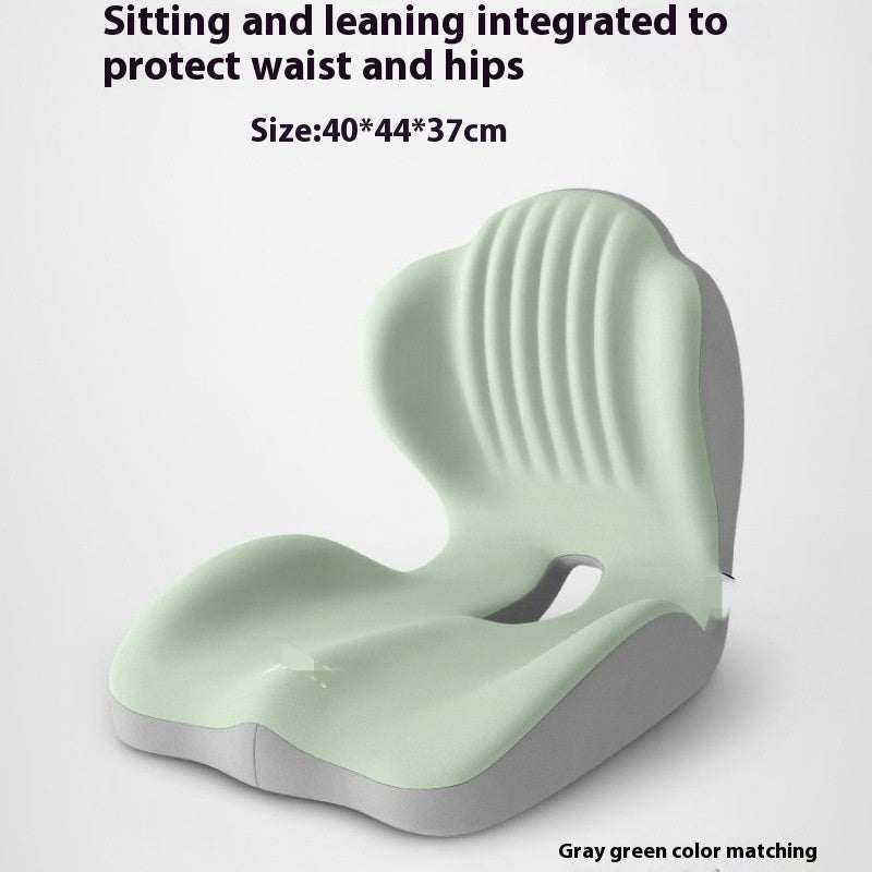 Ergonomic seat cushion in pale gray-green with a contoured seat, raised back support and ribbed padding