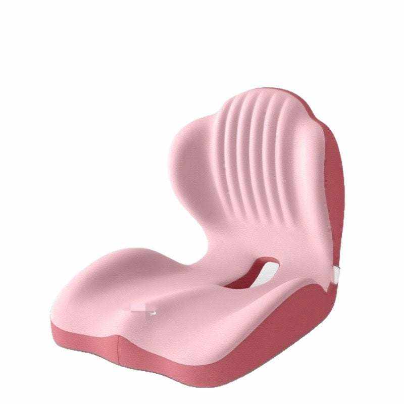 ergonomic seat cushion in pink with a contoured padded seat, raised back support and textured vertical grooves