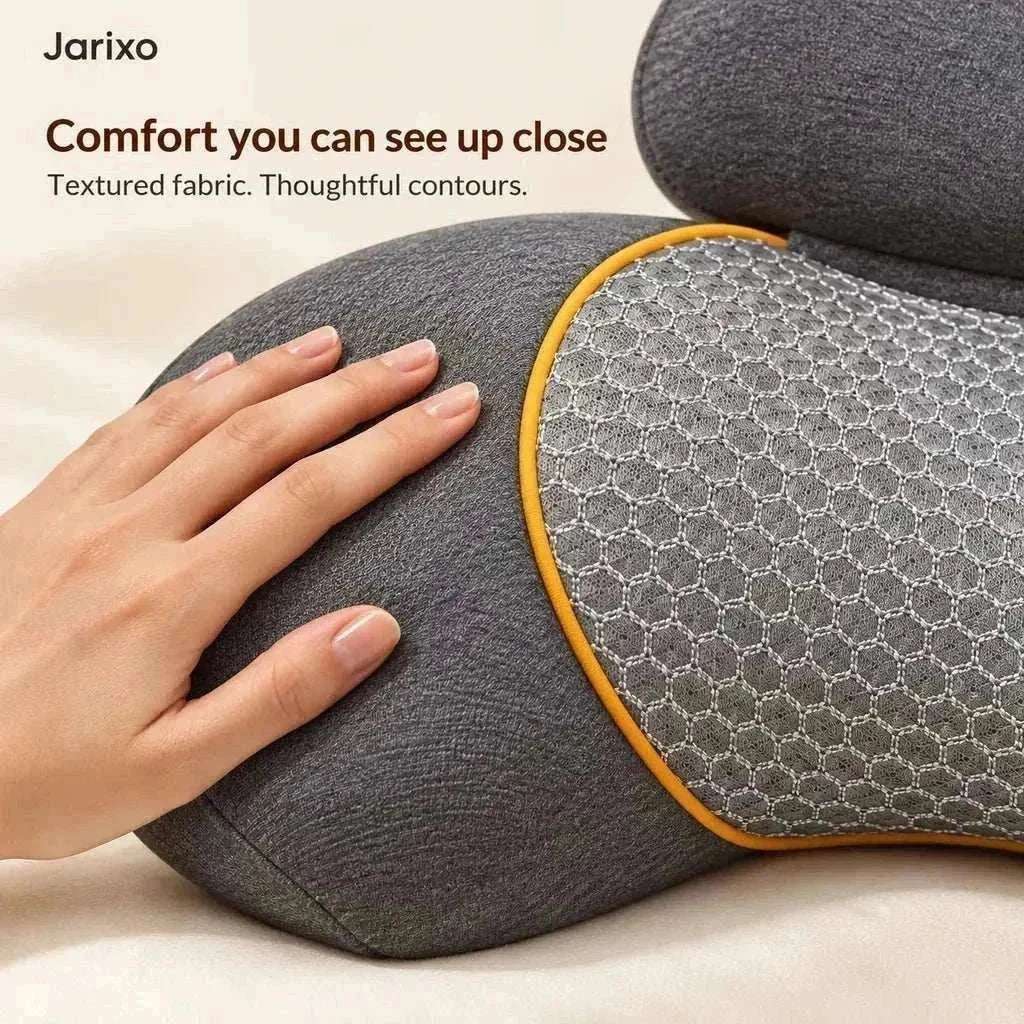 neck massager pillow in charcoal grey textured fabric with a mesh panel, orange piping and curved contours